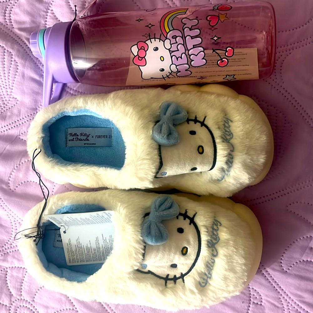 Hello Kitty Slippers. Free Hello Kitty water bottle with purchase.